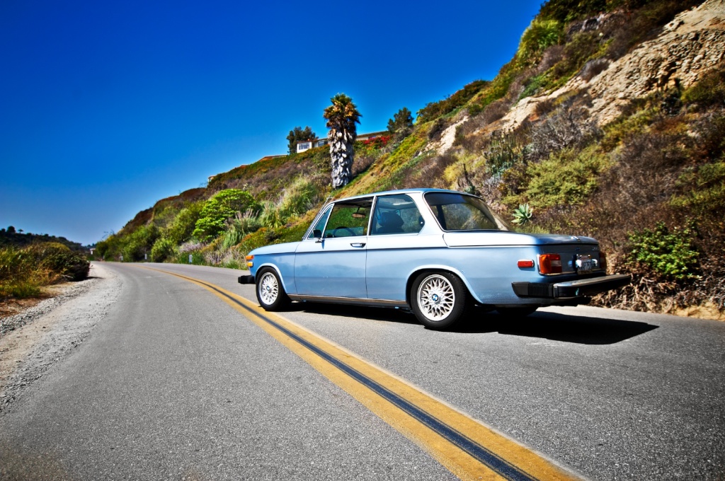 1976 Fjord Blue BMW 2002 lowered with BBS rims and big bumpers.